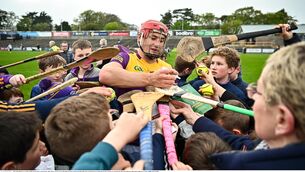 <p>Lee Chin of Wexford signs autographs after the Leinster GAA Hurling Senior Championship Round 2 match against Antrim. Picture: by Tyler Miller/Sportsfile</p>