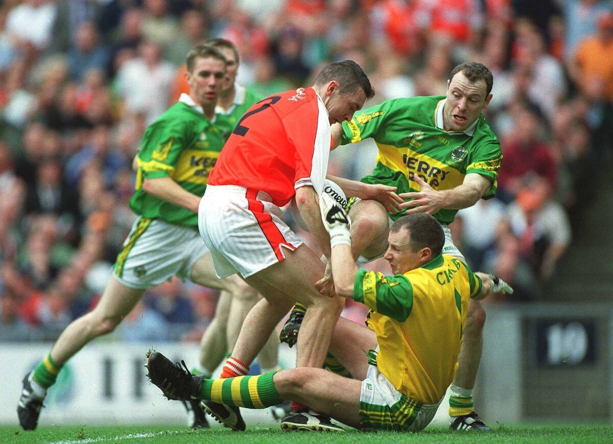 PENALTY: Armagh's Oisin McConville is tackled by O'Keeffe and Seamus Moynihan for the penalty that the Rathmore man saved just before half time in the 2000 All-Ireland final. 