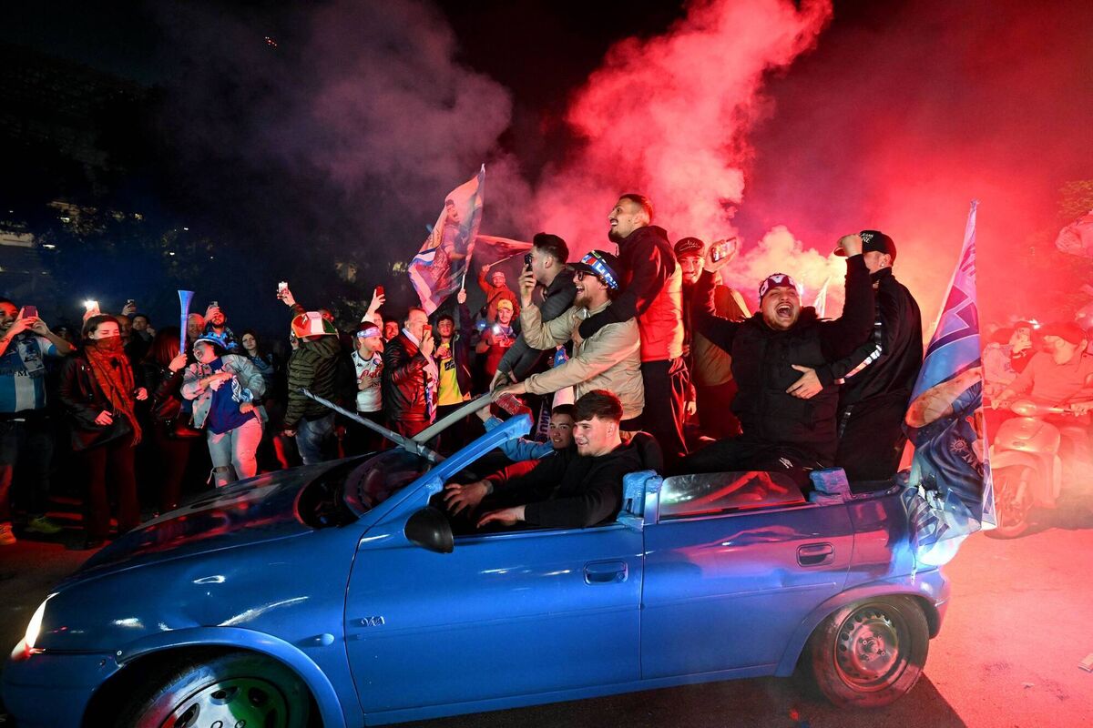Napoli fans celebrate with flares outside the stadium after their side won the Serie A title. Picture: Francesco Pecoraro/Getty