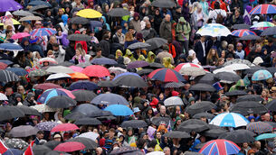 <p>Crowds near Trafalgar Square take shelter from the rain ahead of the coronation ceremony.</p> <p>Crowds near Trafalgar Square take shelter from the rain ahead of the coronation ceremony.</p>