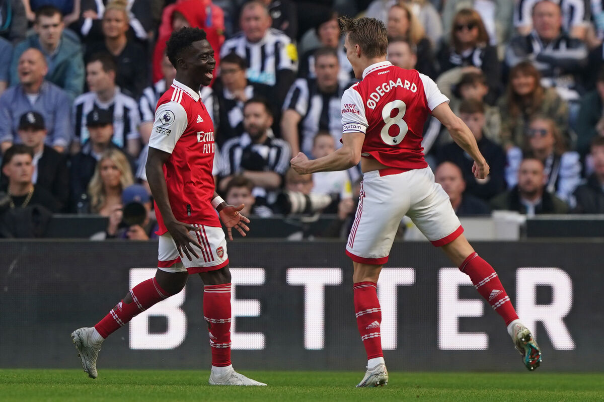 Arsenal's Martin Odegaard (right) celebrates after scoring their sides first goal during the Premier League match at St. James' Park, Newcastle upon Tyne. Picture date: Sunday May 7, 2023.