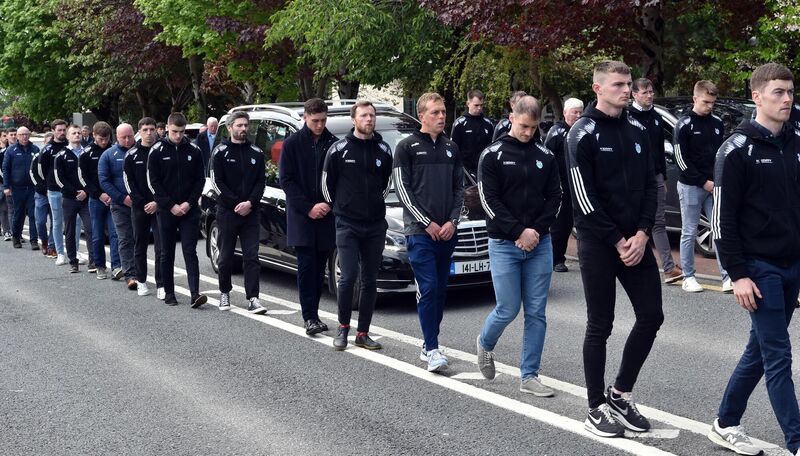  COLLEAGUES: Members of the Kerry squad form a guard of honour in Fossa on Tuesday.