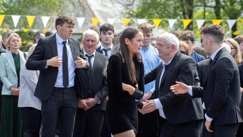  FAMILY: The Cliffords, David, Shelly, father Dermot and Paudie at the funeral of their mother Ellen in Christ Prince of Peace Church in Fossa