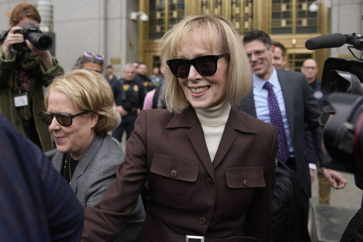 E. Jean Carroll, center, walks out of Manhattan federal court, Tuesday, May 9, 2023, 2023, in New York. Picture: AP Photo/Seth Wenig