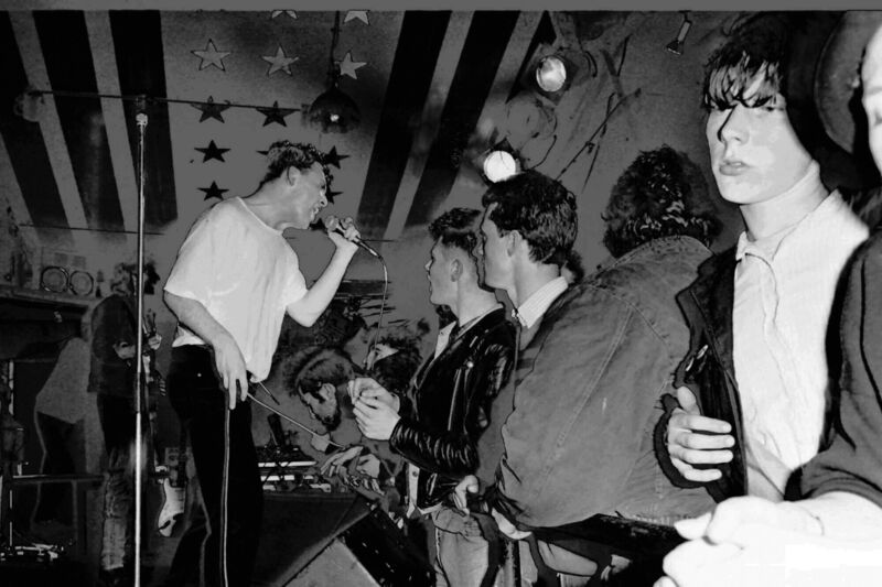 Cathal Coughlan of Microdisney on stage in Sir Henry's, Cork, in 1988. Sean O'Hagan can be seen in the background playing guitar. Picture: Eddie O'Hare Cathal Coughlan of Microdisney on stage in Sir Henry's, Cork, in 1988. Sean O'Hagan can be seen in the background playing guitar. Picture: Eddie O'Hare