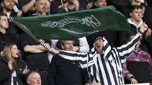 <p>FLYING THE FLAG: A Newcastle United fan waves a Saudi Arabian flag during the Premier League match between Newcastle United and Tottenham Hotspur at St. James Park. Pic: Daniel Chesterton/Offside/Offside via Getty Images</p>