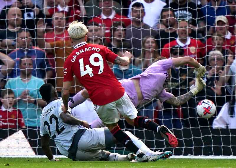 Manchester United's Alejandro Garnacho scores their side's second goal of the game during the Premier League match at Old Trafford, Manchester. Picture date: Saturday May 13, 2023. PA Photo. See PA story SOCCER Man Utd. Photo credit should read: Tim Goode/PA Wire. Manchester United's Alejandro Garnacho scores their side's second goal of the game during the Premier League match at Old Trafford, Manchester. Picture date: Saturday May 13, 2023. PA Photo. See PA story SOCCER Man Utd. Photo credit should read: Tim Goode/PA Wire.