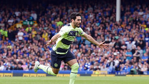 <p>ON SONG: Manchester City's Ilkay Gundogan celebrates scoring their side's third goal at Goodison Park.</p>