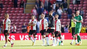 <p>DEJECTED: Southampton players react to relegation to the Sky Bet Championship following the Premier League match against Fulham. Pic: Adam Davy/PA Wire</p>