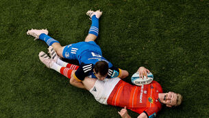 <p>BLUE ON RED: Munster’s Ben Healy tackled by Luke McGrath of Munster at the weekend. Picture: INPHO/Ben Brady</p>