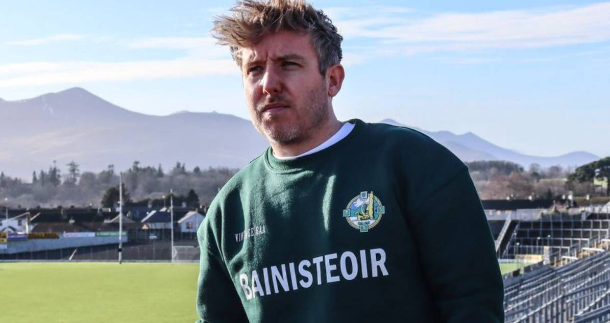 VintageGAA.ie owner Adam Moynihan sporting a vintage Kerry GAA Bainisteoir sweatshirt. Pic: AdamMoynihan/Twitter. 