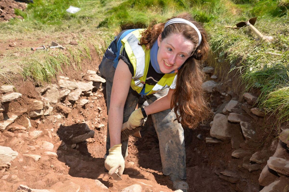 Archaeology Plan Director Philippa Barry excavating a trench beside Ferriter's Castle. A piece of charcoal found 1.2 metres below the surface at this site could be evidence of human activity pre-dating the existence of the castle. Photo: Declan Malone