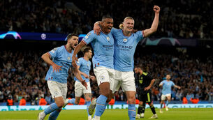 <p>Manchester City's Rodri, Manuel Akanji, and Erling Haaland celebrate the own goal of Real Madrid's Gabriel Eder Militao during the UEFA Champions League semi-final second leg match at Etihad Stadium, Manchester</p>