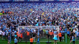 <p>ANOTHER TITLE: Manchester City fans invade the pitch as they celebrate their Premier League title win. Pic: Martin Rickett/PA Wire</p>