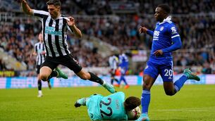 <p>SAFE HANDS: Newcastle United's Fabian Schar (left) leaps over goalkeeper Nick Pope as he makes a save during the Premier League match at St. James' Park. Pic: Owen Humphreys/PA Wire</p>
