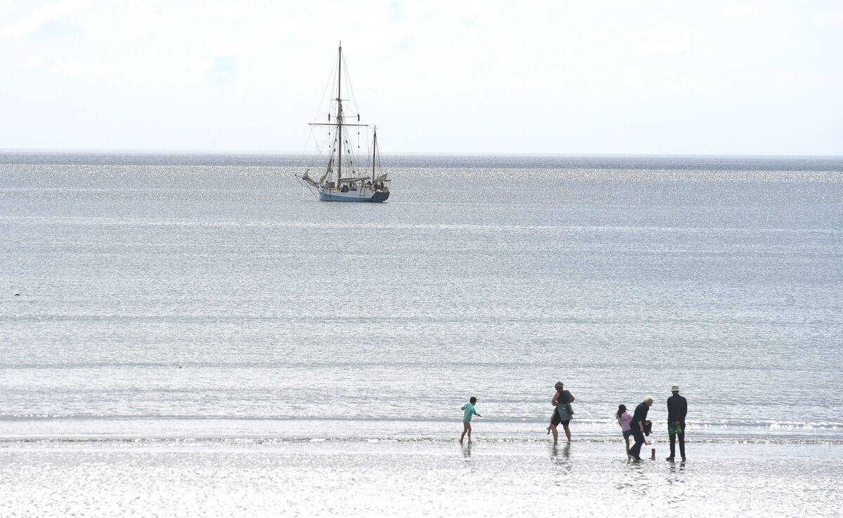 The sail vessel Ilen passes Fountainstown Co Cork on Thursday 18th May 2023 as people stroll on the beach inthe bright sunshine. Picture: Larry Cummins The sail vessel Ilen passes Fountainstown Co Cork on Thursday 18th May 2023 as people stroll on the beach inthe bright sunshine. Picture: Larry Cummins
