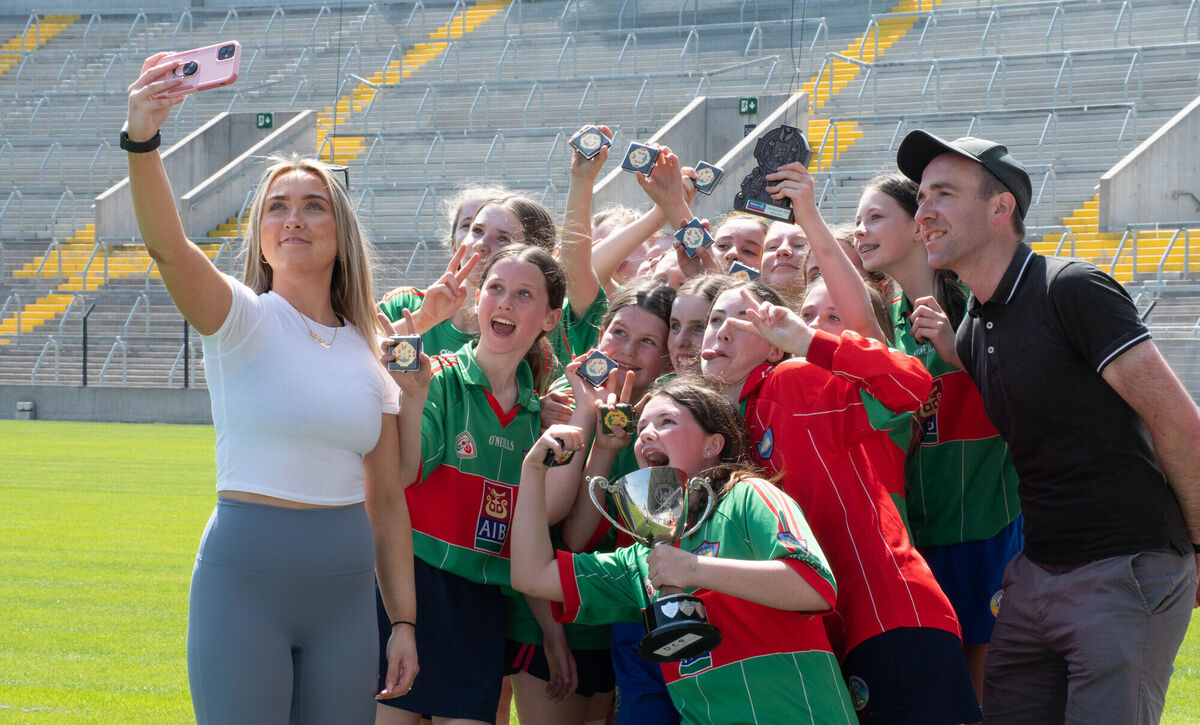 GS Mhuscrai pose for a selfie with their coaches following their victory over Coachford in the Allianz Sciath na Scol DC8 final in Pairc Ui Chaoimh. Picture: Howard Crowdy
