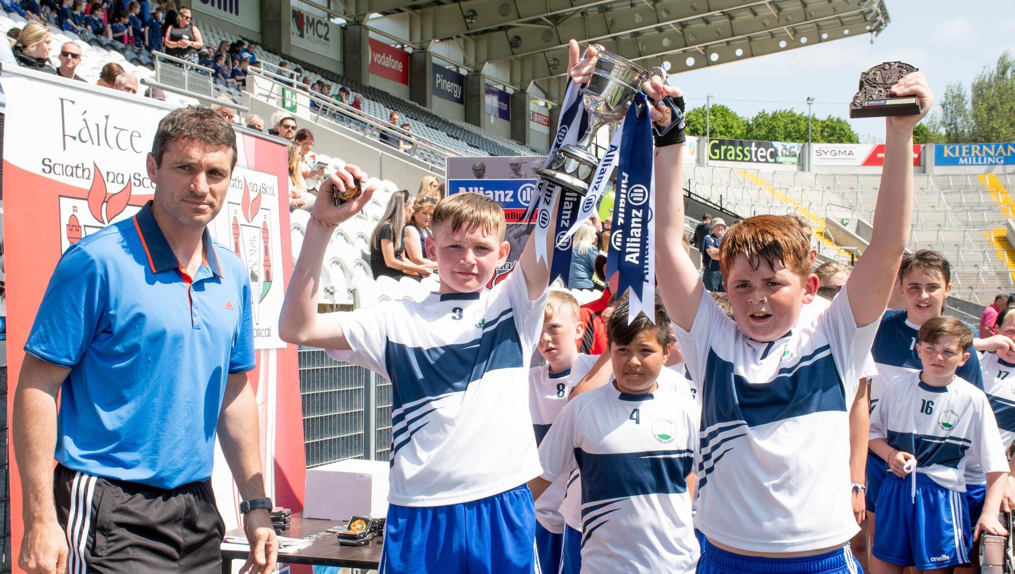  CHAMPIONS: Tom Kenny pictured presenting joint team captains Mikey Stokes and Sean Crean of St Marys on the Hill with the Cup. Picture: Howard Crowdy