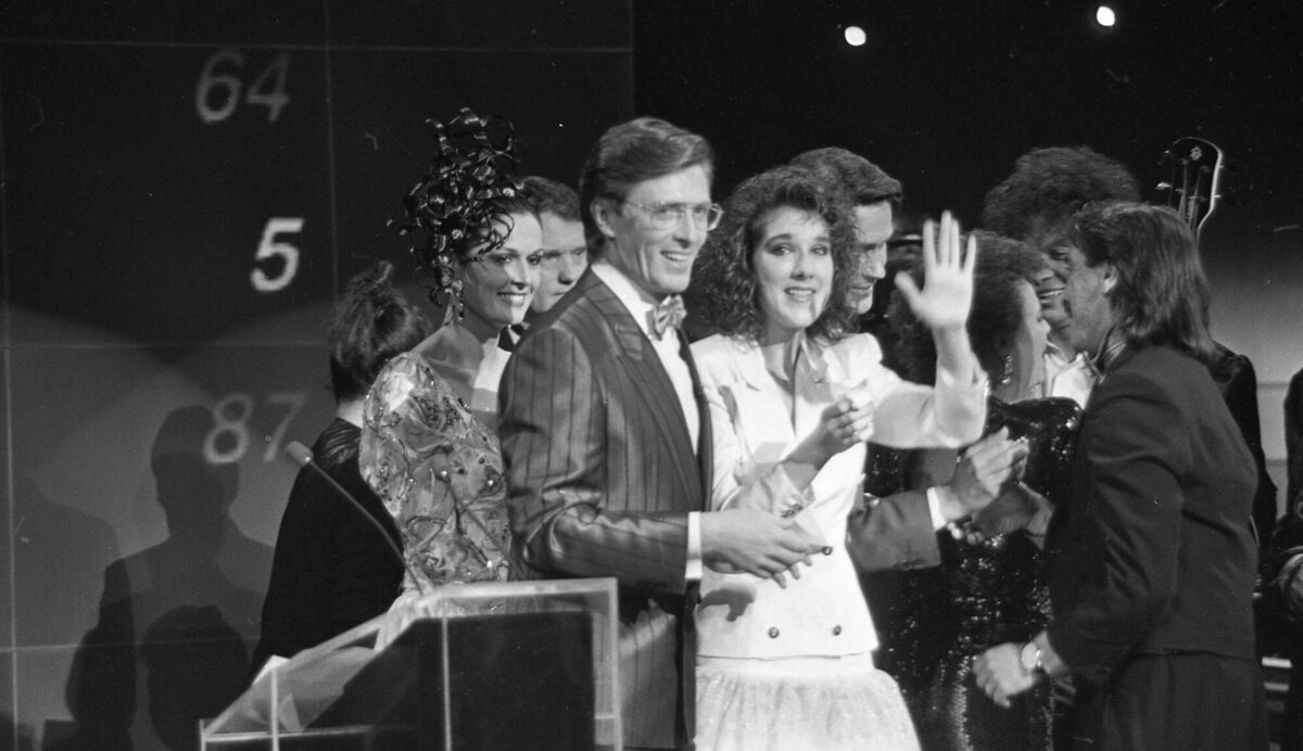 Celine Dion pictured on stage with Pat Kenny after winning the Eurovision for Switzerland in 1988 in Dublin. Picture: Independent News and Media/Getty Images Celine Dion pictured on stage with Pat Kenny after winning the Eurovision for Switzerland in 1988 in Dublin. Picture: Independent News and Media/Getty Images