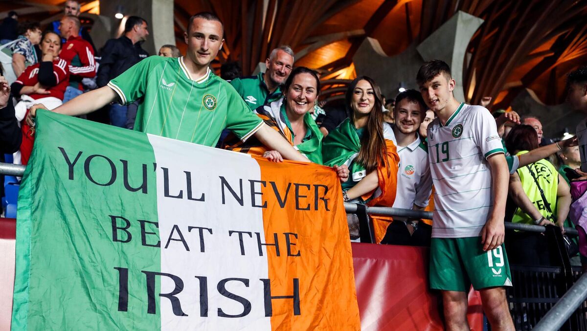 MADE IT: Ireland’s Mason Melia celebrates qualifying for the knockout phase with friend and family. Pic: INPHO/Nikola Kristic
