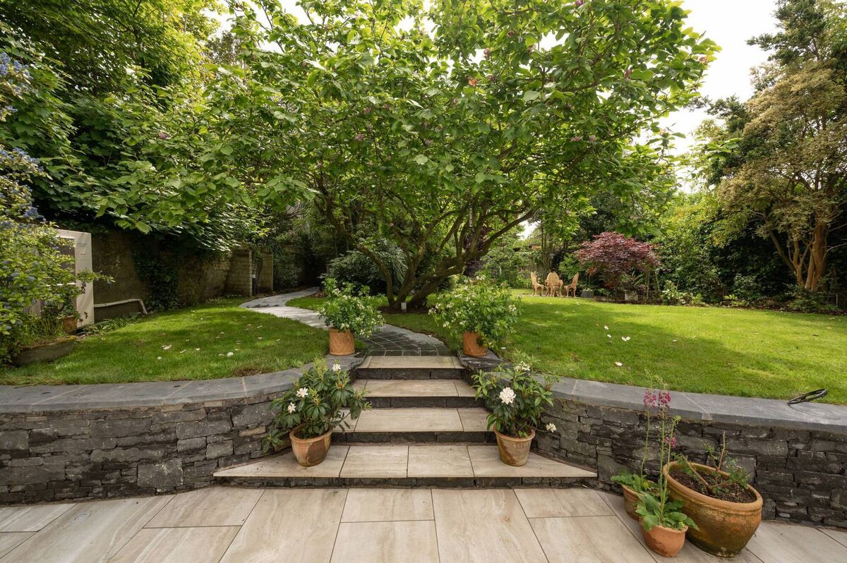 Back garden is large, with mews at the far end and second access off a cul de sac lane