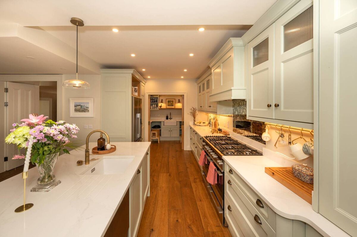 View towards pantry past kitchen island