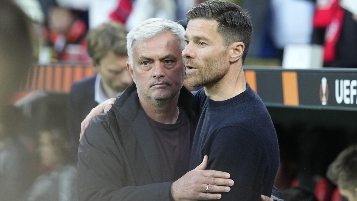 OLD FRIENDS: Roma's head coach Jose Mourinho, left and Leverkusen's head coach Xabi Alonso  before the semi-final. Picture: AP Photo/Martin Meissner