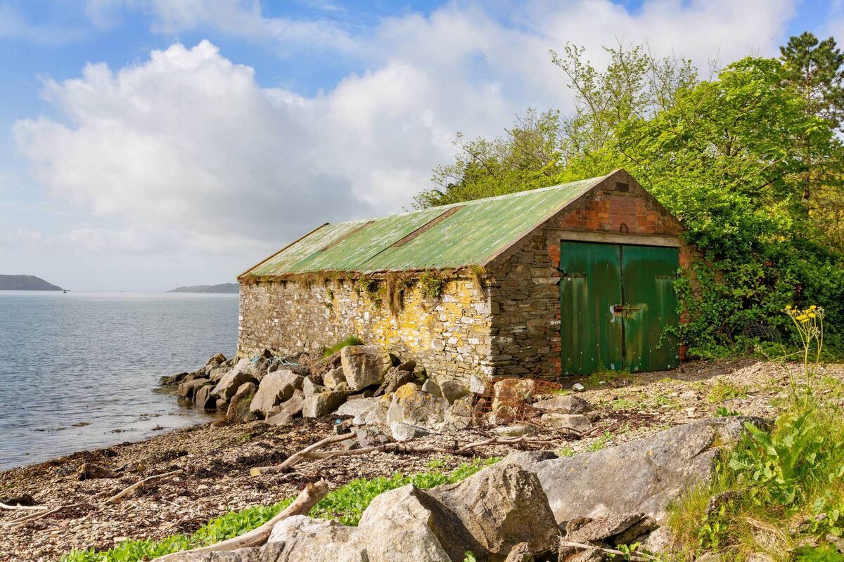 Boathouse with remains of rails and winch for hauling craft up 