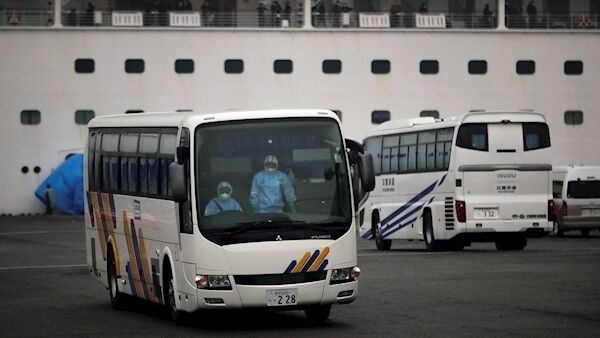 A bus leaves the quarantined Diamond Princess cruise ship at a port Sunday, Feb. 16, 2020, in Yokohama, near Tokyo. (AP Photo/Jae C. Hong) A bus leaves the quarantined Diamond Princess cruise ship at a port Sunday, Feb. 16, 2020, in Yokohama, near Tokyo. (AP Photo/Jae C. Hong)