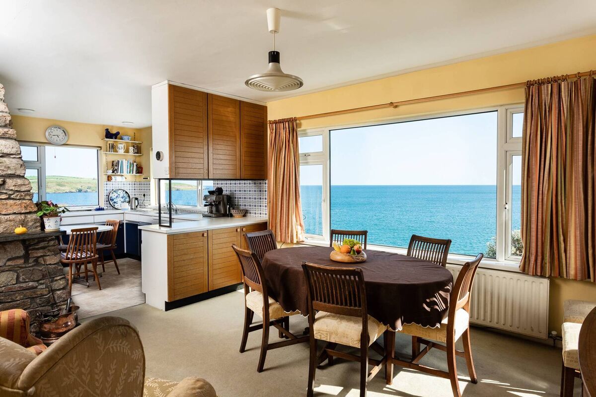 Picture windows and a coastal panorama outside Picture windows and a coastal panorama outside