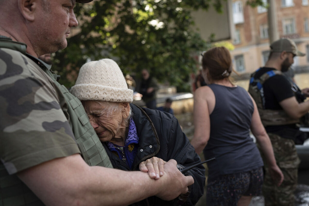 A woman cries as she is evacuated from a flooded neighbourhood in Kherson, Ukraine, Wednesday, June 7, 2023 after the Kakhovka dam was blown up. Picture: AP Photo/Roman Hrytsyna