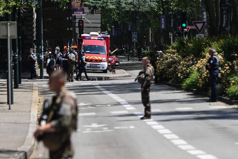 French police officers standing next to an emergency truck in Annecy this morning. Picture: Oliver Chassignole/AFP via Getty Images French police officers standing next to an emergency truck in Annecy this morning. Picture: Oliver Chassignole/AFP via Getty Images