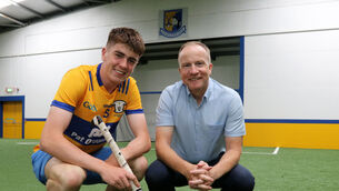 <p class="contextmenu internal_Caption">PASSING ON THE KNOWLEDGE: Matthew and Michael O’Halloran at Sixmilebridge GAA Arena. Pic: Brendan Gleeson</p>