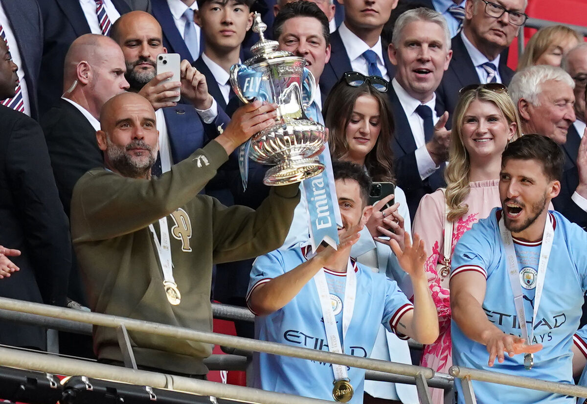 Pep Guardiola lifts the FA Cup after Manchester City’s defeat of Manchester United in the final on 3 June. It was the 11th major honour Guardiola has won since joining the club. 