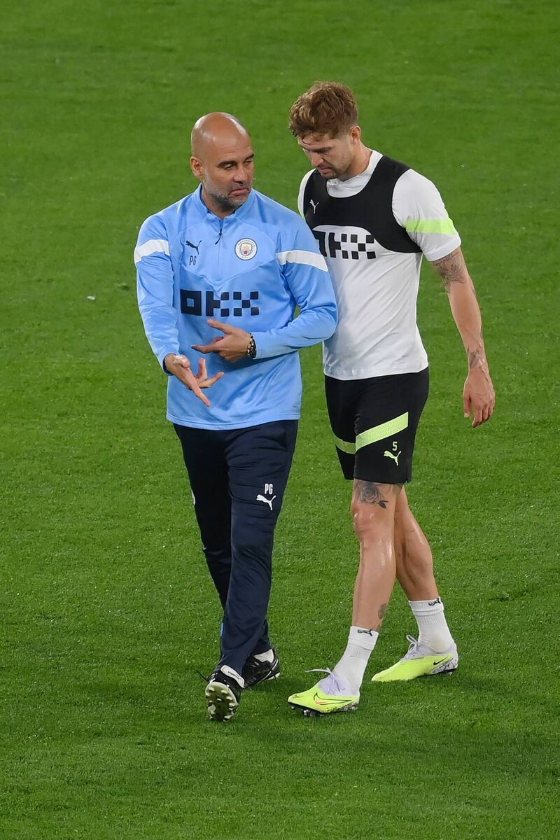 Pep Guardiola at a Manchester City training session in Istanbul with John Stones, who has excelled this season in a new role. Pic: Shaun Botterill/Getty Images