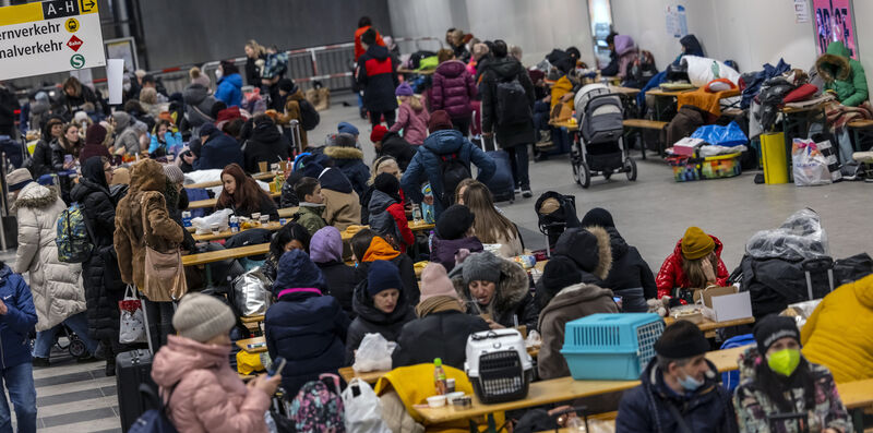 People waiting in a reception centre for refugees from Ukraine at the main train station in Berlin, Germany, on March 13, 2022. Picture: Hannibal Hanschke/DPA/AP