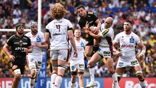 <p>CONTEST: La Rochelle fullback Brice Dulin and Bordeaux scrum-half Maxime Lucu jump to grab the ball during the French Top 14 semi-final at Anoeta Reale Arena stadium in San-Sebastian. Pic: Gaizka Iroz/AFP via Getty Images</p>