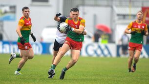 <p>SEMIS BOUND: Mikey Bambrick of Carlow in action against Liam Kearney of New York. Photo by Matt Browne/Sportsfile</p>