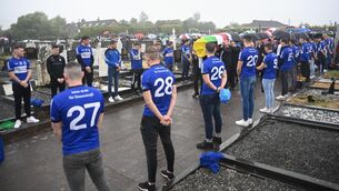 <p>STANDING PROUD: Sarsfield players form a guard of honour for Cork sporting legend Teddy McCarthy as his remains are carried to his grave at Rathcooney Cemetery, after requiem mass at St Joseph's Church, Glanmire on Saturday. Pic: Larry Cummins</p>