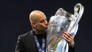 <p>TREBLE DELIGHT: City manager Pep Guardiola kisses the Champions League trophy. </p>
