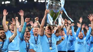 <p>CHAMPIONS: Manchester City's Erling Haaland with the Champions League trophy. Pic: PA</p>