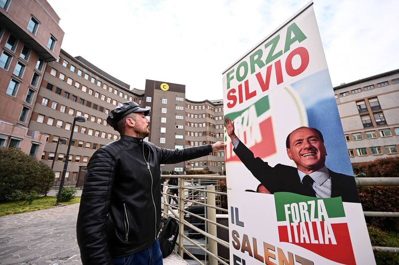 A man sets up a banner reading "Go Silvio!" in front of San Raffaele hospital where former Italian Prime Minister, Silvio Berlusconi, was hospitalised in Milan on April 7, 2023. Picture: PIERO CRUCIATTI/AFP via Getty Images A man sets up a banner reading "Go Silvio!" in front of San Raffaele hospital where former Italian Prime Minister, Silvio Berlusconi, was hospitalised in Milan on April 7, 2023. Picture: PIERO CRUCIATTI/AFP via Getty Images