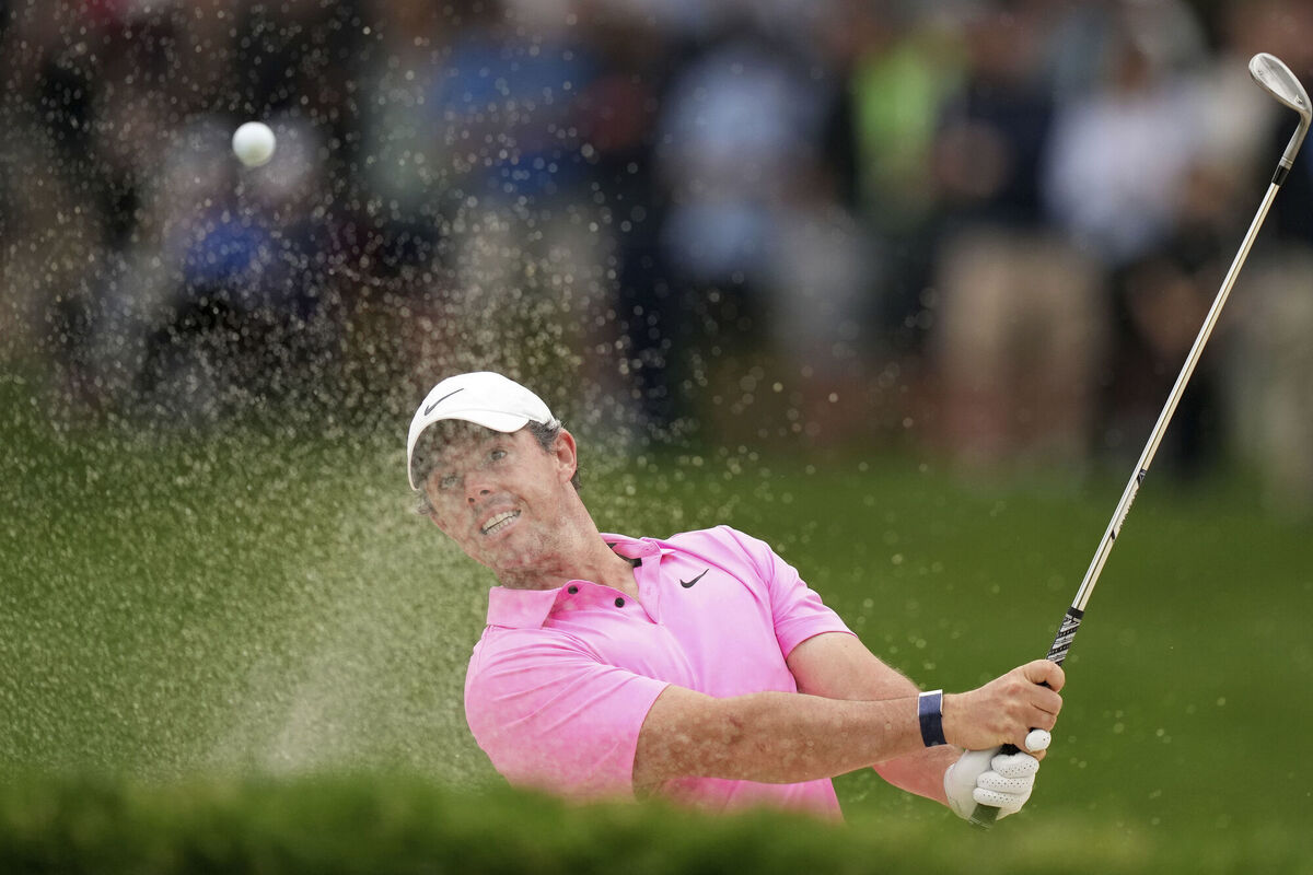 Rory McIlroy hits out of a bunker. (Nathan Denette/The Canadian Press via AP)