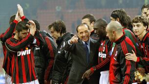 <p>GLORY DAYS: Silvio Berlusconi poses with AC Milan players in 2006. Pic: Giuseppe Cacace/AFP via Getty Images</p>