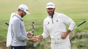 <p>CALIFORNIA DREAMIN': Dustin Johnson and his caddie and brother Austin Johnson look on from the second green during a practice round at The Los Angeles Country Club on Monday. Pic: Harry How/Getty Images</p>