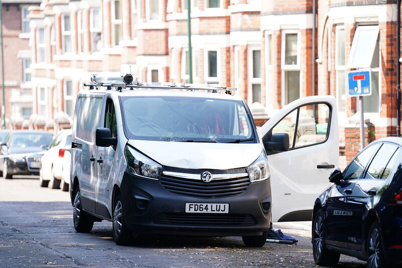 A white van behind a police cordon on the corner of Maples Street and Bentinck Road in Nottingham, as three people have been found dead in the city in what police described as a "horrific and tragic incident". Picture: Dave Higgens/PA Wire