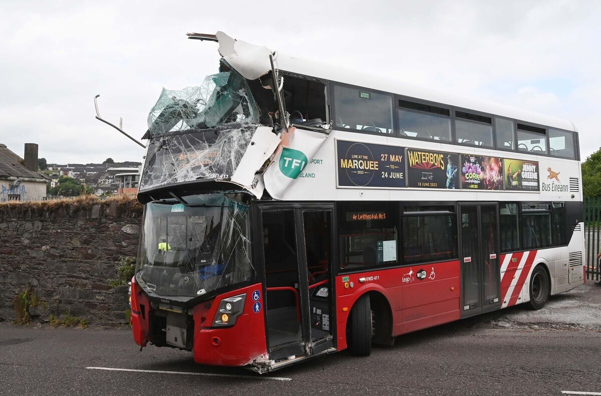 A Bus Éireann bus being driven away after it collided with the crash rail at a railway bridge at Dublin Hill, Cork. Picture: Denis Minihane. A Bus Éireann bus being driven away after it collided with the crash rail at a railway bridge at Dublin Hill, Cork. Picture: Denis Minihane.