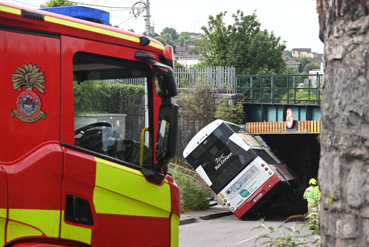Emergency services at the scene after a Bus Éireann bus collided with the crash rail at a railway bridge at Dublin Hill, Cork. Picture: Denis Minihane. Emergency services at the scene after a Bus Éireann bus collided with the crash rail at a railway bridge at Dublin Hill, Cork. Picture: Denis Minihane.