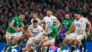 <p>18 March 2023; Mack Hansen of Ireland is tackled by Jack van Poortvliet of England during the Guinness Six Nations Rugby Championship match between Ireland and England at Aviva Stadium in Dublin. Photo by Ramsey Cardy/Sportsfile</p>