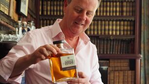 <p>Maurice O'Connell with his Lakeview Whiskey - distilled with barley from his family farm in Fossa, Killarney, Co Kerry</p>